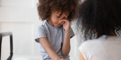 a mother comforting her child